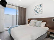 Main Bedroom with King Size Bed with Quilts | Luxury Penthouse Apartment